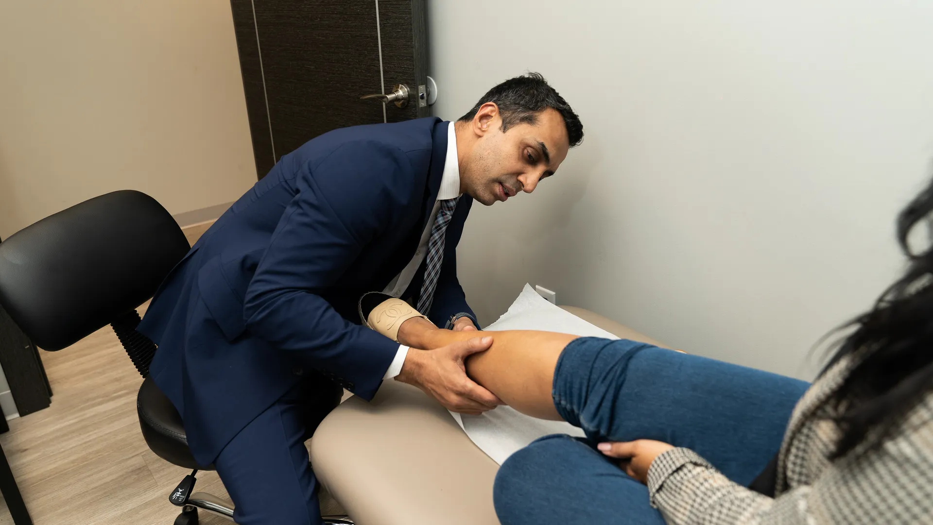 Dr. Sood examining patient